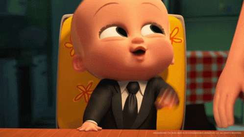Baby in Suit Sitting in Chair