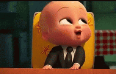 Baby in Suit Sitting in High Chair
