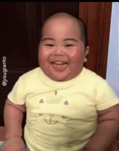 Baby In Yellow Shirt With Cat Smiling GIF
