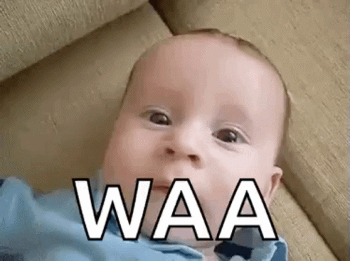 Baby Laying On Couch Making Funny Face Waa GIF