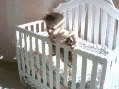 Baby Looking Out Window From White Crib GIF