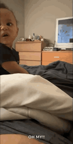 Baby Lying on Bed Saying Oh My