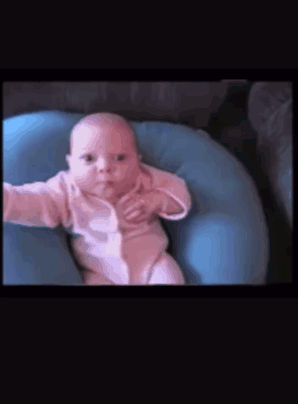 Baby Lying on Blue Pillow