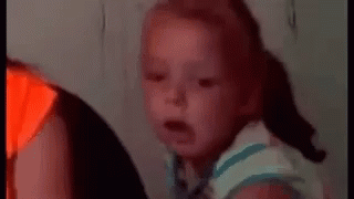Baby Making Funny Face on Couch