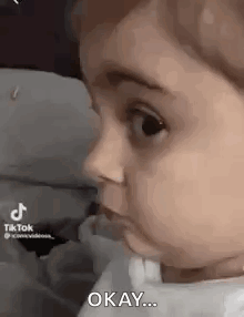 Baby Making Funny Face Saying Okay GIF