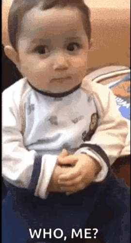 Baby Making Funny Face Saying Who Me