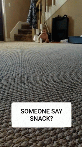 Baby on Floor With Someone Saying Snack