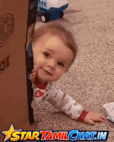 Baby Peeking Out of Cardboard Box With Star Tamilchat.in Logo