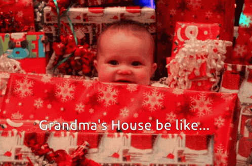 Baby Peeking Out of Christmas Presents Grandma's House Be Like