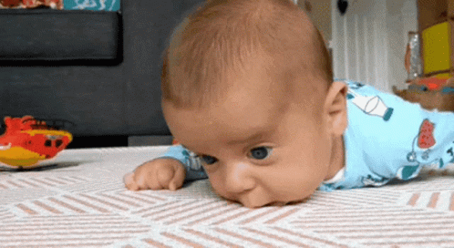 Baby Peeking Out of Christmas Presents Grandma's House Be Like