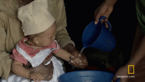 Baby Poured Water From Blue Pitcher Natgeotv.com