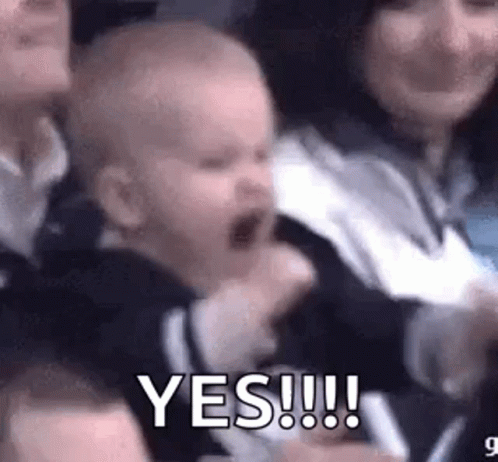 Baby Screaming In Crowd Held By Woman Saying Yes GIF