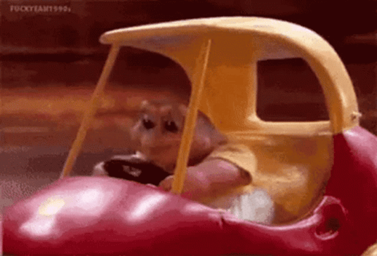 Baby Sinclair Driving A Fast Toy Car GIF