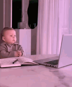 Baby Sitting at Desk with Laptop