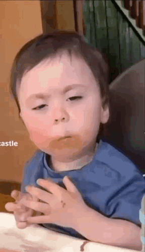 Baby Sitting in High Chair Making Face