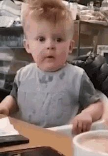 Baby Sitting in High Chair Making Funny Face