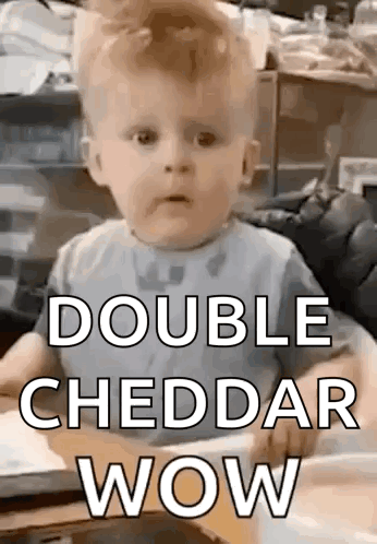 Baby Sitting in High Chair With Double Cheddar Wow