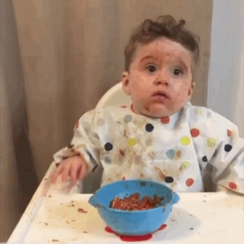 Baby Sitting in High Chair with Food