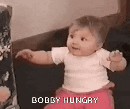 Baby Sitting on Couch Looking at Camera