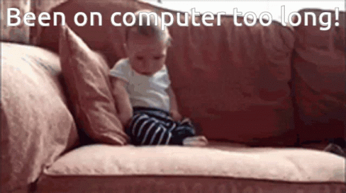 Baby Sitting on Couch Saying Been on Computer Too Long