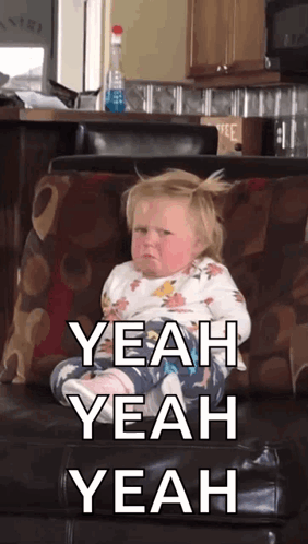 Baby Sitting On Couch Saying Yeah Yeah Yeah GIF