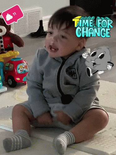 Baby Sitting on Floor With Time for Change Sticker