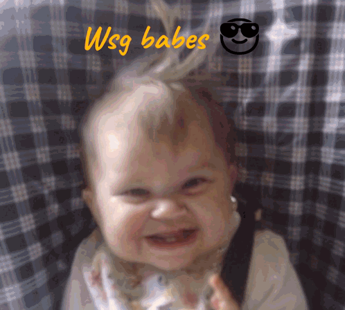 Baby Smiling in Front of WSG Babes Sign