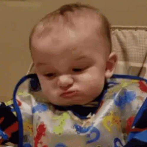 Baby Wearing Bib Making Funny Face