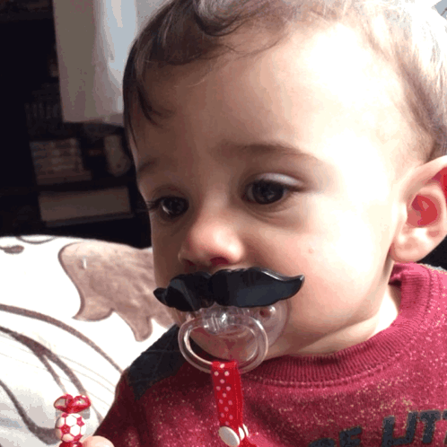 Baby Wearing Pacifier With Fake Mustache
