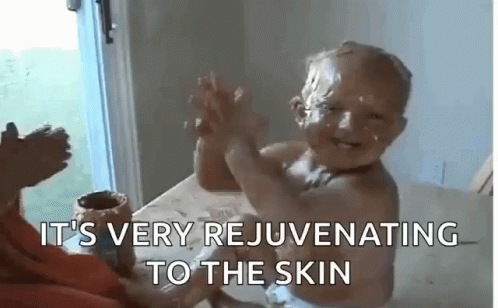 Baby with Chocolate Face Giving High Five