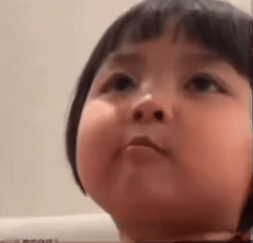 Baby With Short Hair Making Funny Face