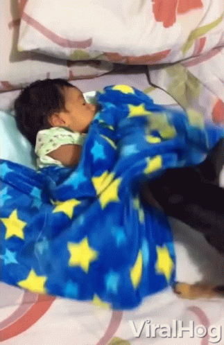 Baby Wrapped in Blue Blanket with Yellow Stars