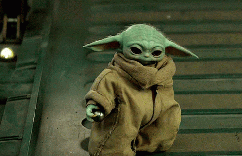Baby Yoda Doll Standing on Staircase