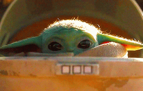 Baby Yoda in a Helmet Close-Up