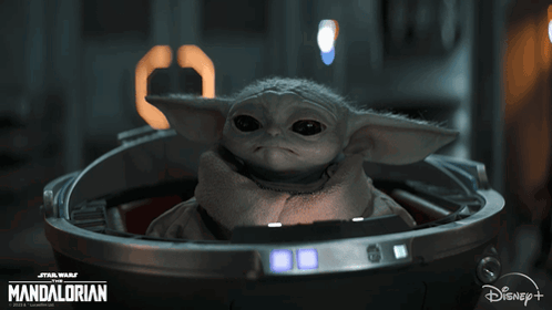 Baby Yoda Sitting in Metal Container