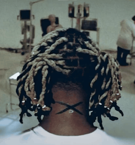 Back of Head With Dreadlocks and X on Neck