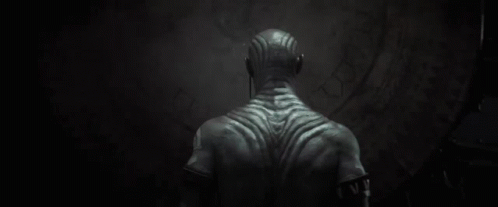 Back of Man With Tattoo Saying W