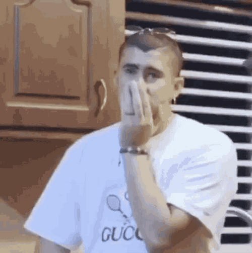 Bad Bunny Covering Face GIF