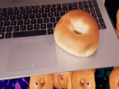 Bagel Bread On Top Of Laptop GIF