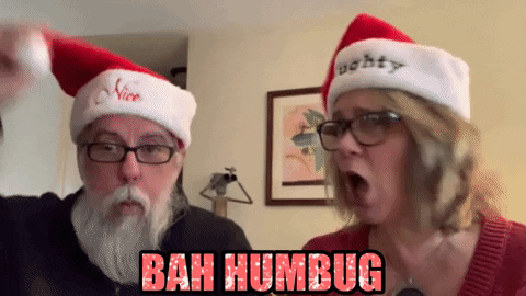 Bah Humbug Matured Couple Wearing Santa Hats GIF