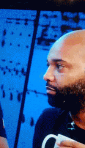 Bald Bearded Man Holding White Cup