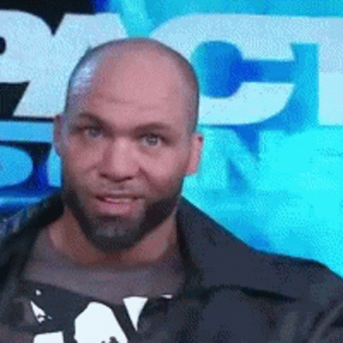 Bald Bearded Man In Front Of NBC Sign GIF