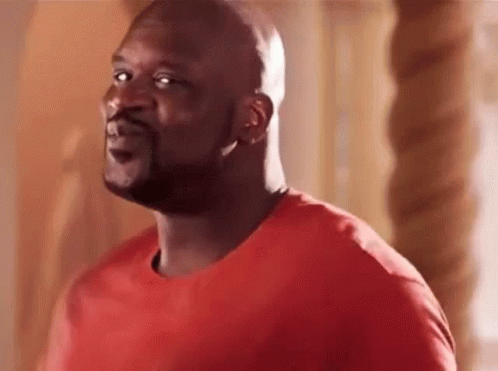 Bald Bearded Man in Red Shirt Looking Up