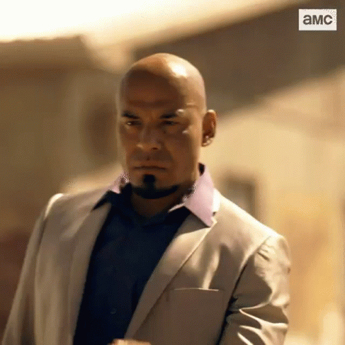 Bald Bearded Man in Suit and Blue Shirt