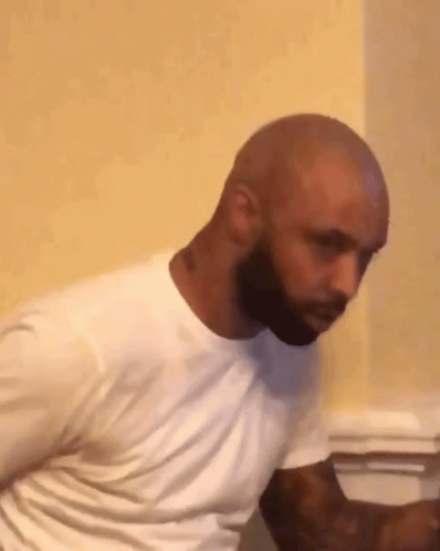 Bald Bearded Man in White T-Shirt