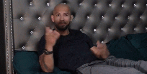 Bald Bearded Man Lying on Bed