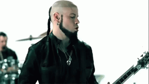 Bald Bearded Man Playing Guitar Drum Set