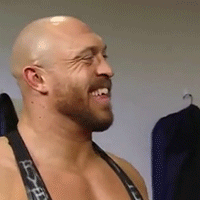 Bald Bearded Man Smiling in Tank Top