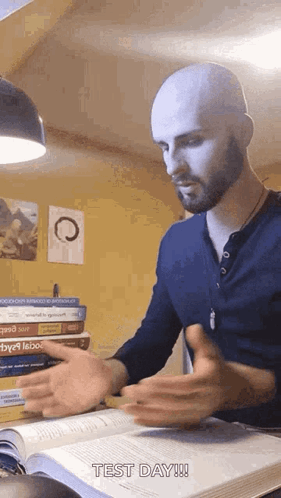 Bald Bearded Man Thumbs Up with Book