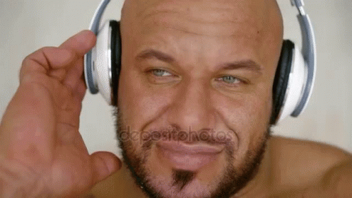 Bald Bearded Man Wearing Headphones